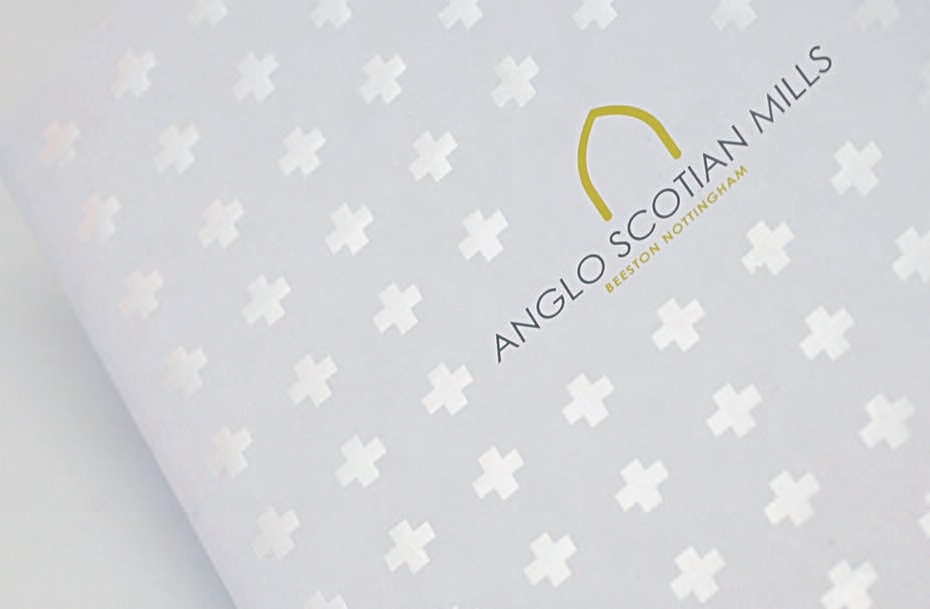 Emblem design for Madame FC depicting an M monogram in a circle with the words "Madame FC EST. 2003" inside on top of a background image of a soccer stadium.